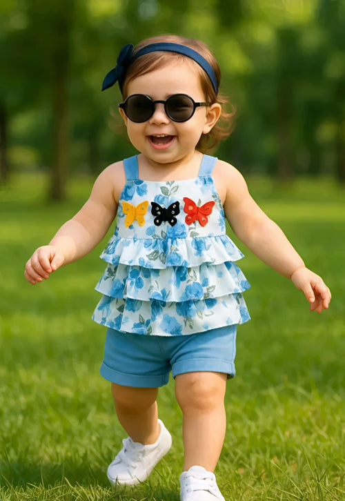 2-piece summer outfit featuring a blue floral ruffle top