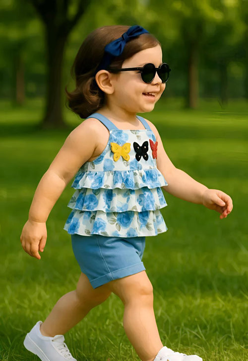 2-piece summer outfit featuring a blue floral ruffle top