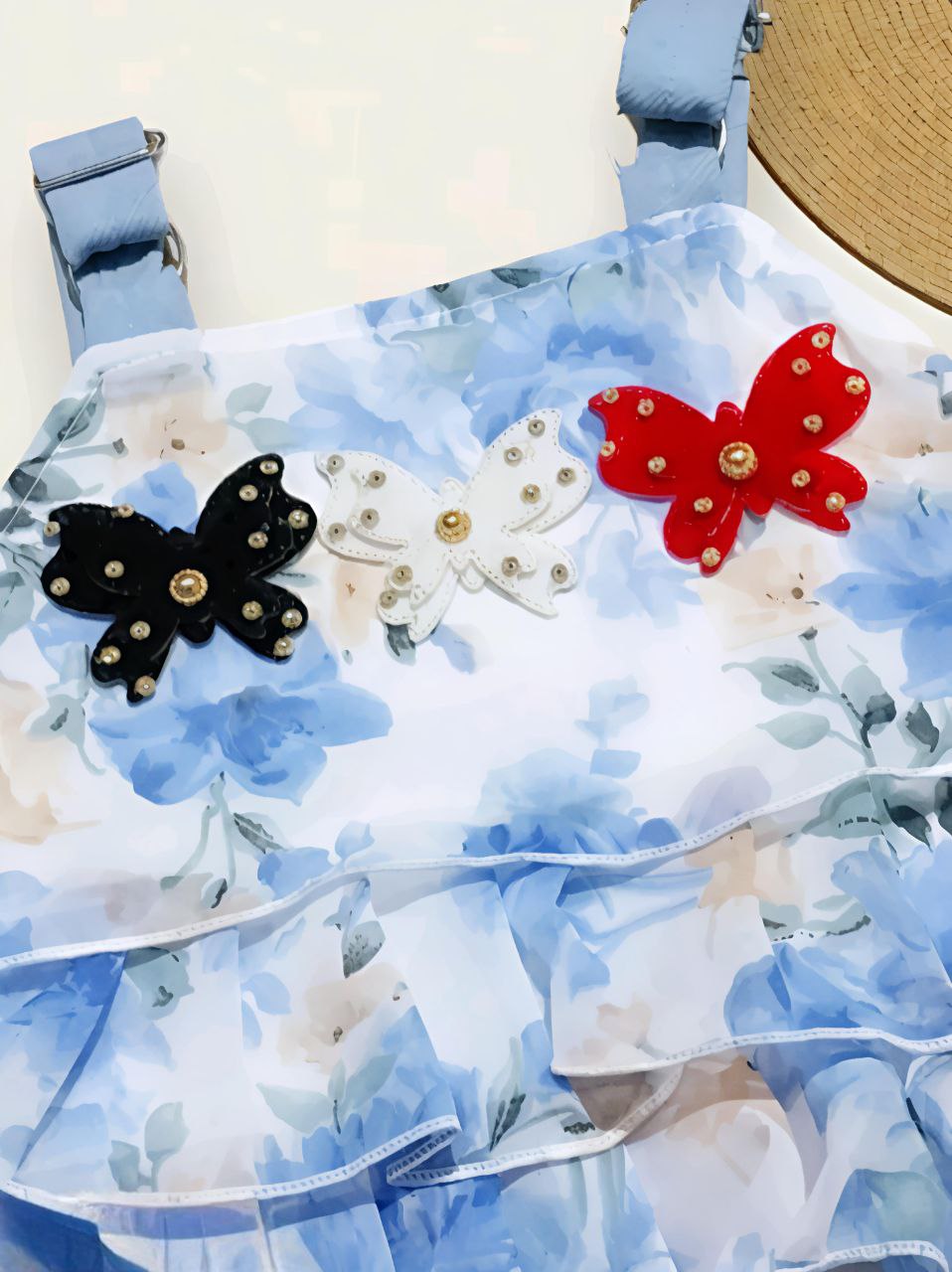 2-piece summer outfit featuring a blue floral ruffle top
